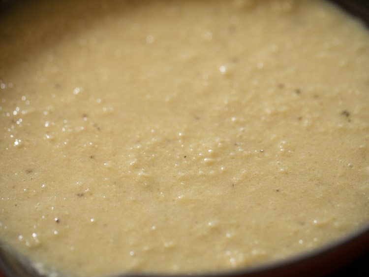 liquid and creamy peda mixture in the pan