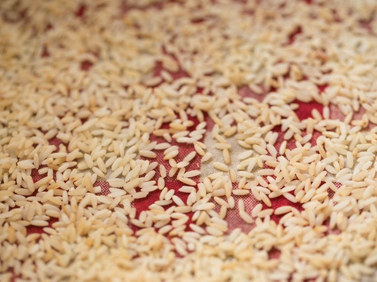 drying drained rice grains on a clean kitchen napkin. 