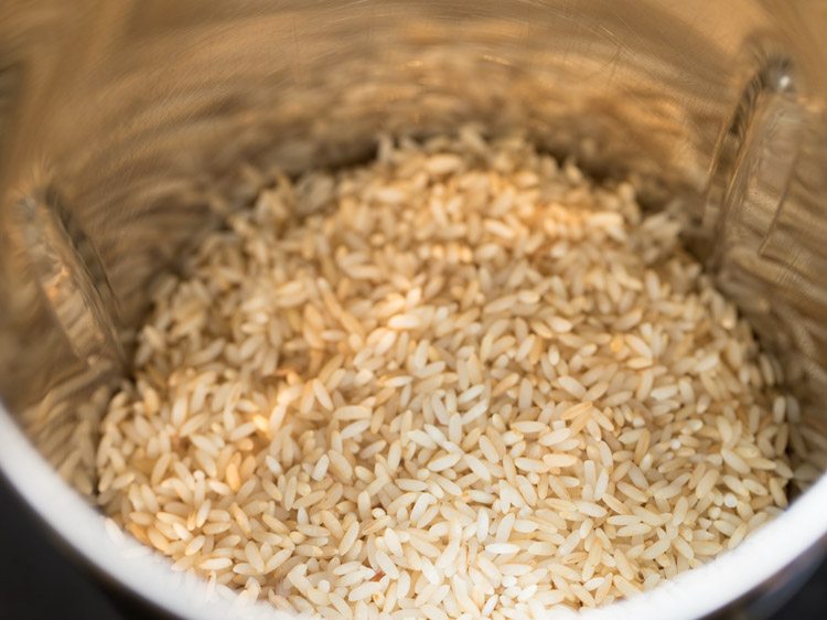 dry rice grains added to a grinder jar. 