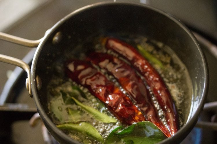 frying chilies in hot oil. 