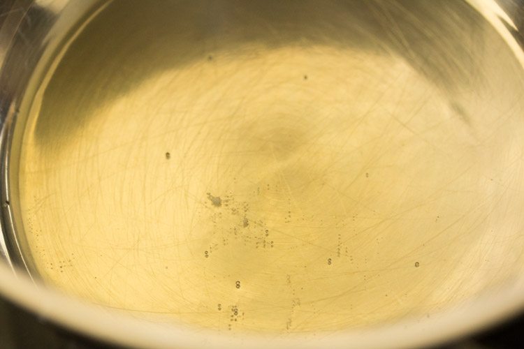 heating sesame oil in a pan. 