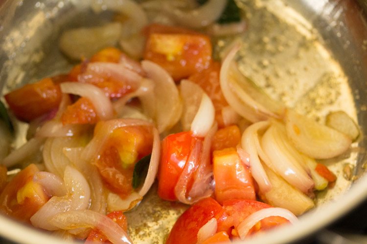 sautéing tomatoes with onions. 