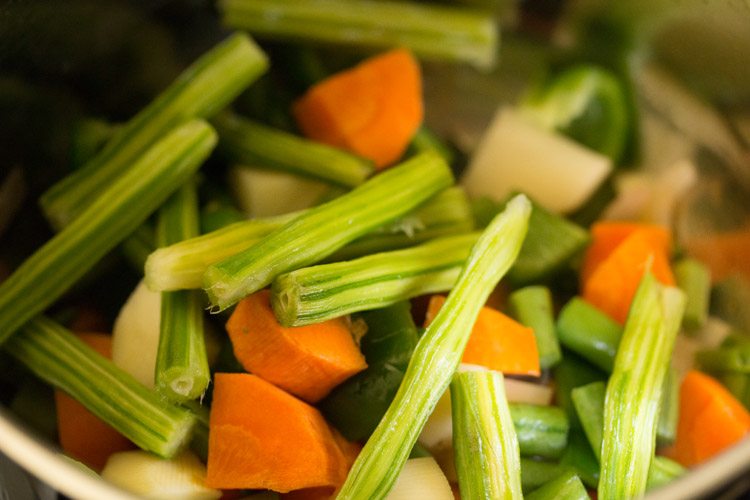 chopped mixed vegetables added to the pan. 