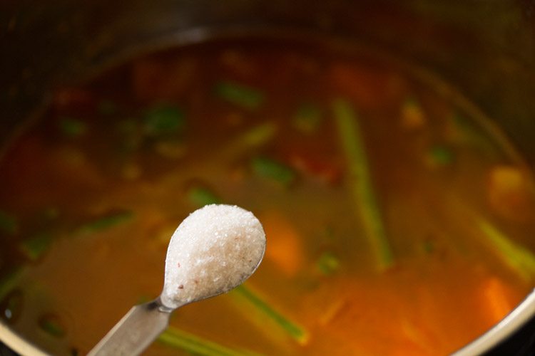 adding salt to the pan. 