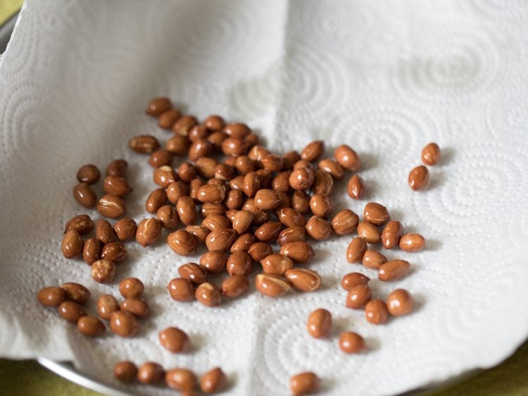 fried peanuts on kitchen paper towels. 