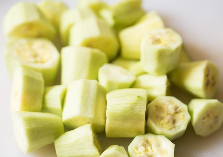 peeled pointed gourd chopped into 2 to 3 pieces for making aloo potoler dalna. 