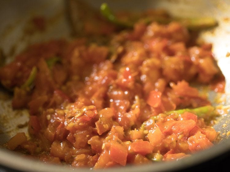 sautéing tomato mixture till soft and mushy, 