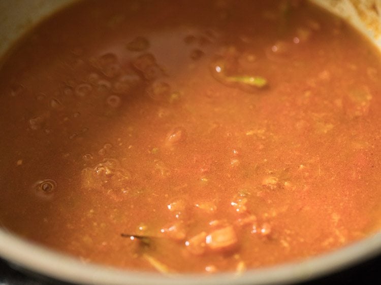 water mixed well in the spiced tomato mixture. 