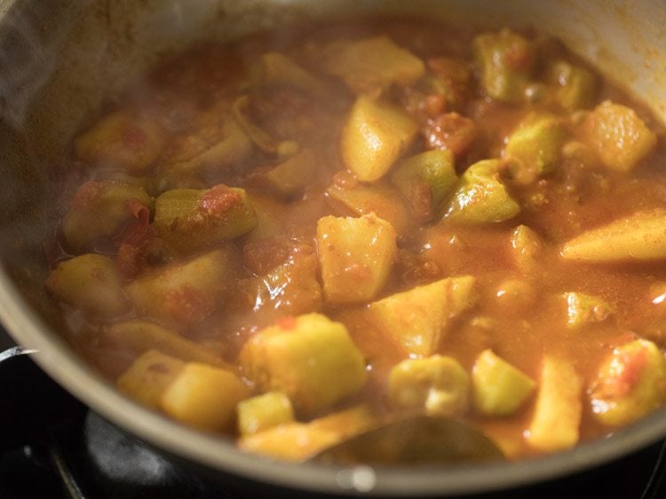 simmering aloo potol curry till it thickens a bit. 