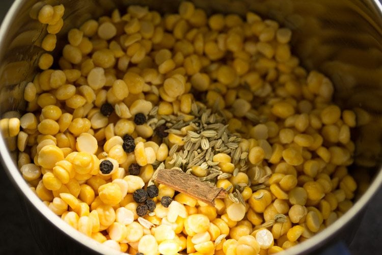 chana dal and spices in a grinder