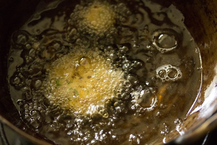 frying vazhaipoo vadai in oil