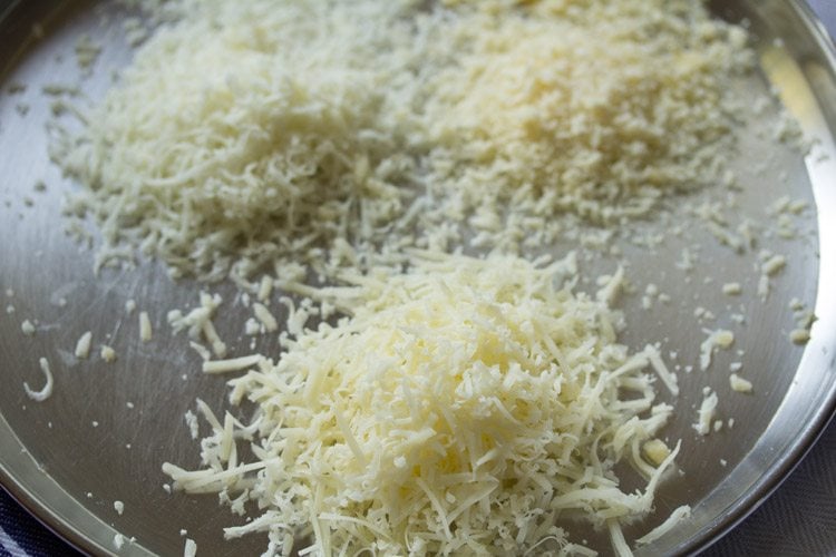 three grated cheese on a plate. 