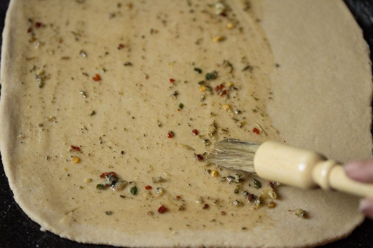 dough sheet brushed with garlic-herb butter. 
