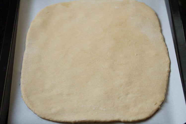rolled dough placed on the parchment paper. 