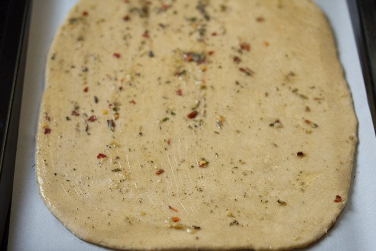 more garlic-herb butter brushed on the rolled dough surface. 