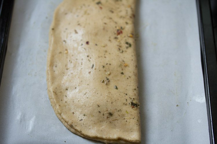 rolled dough folded and pressed at the edges. 