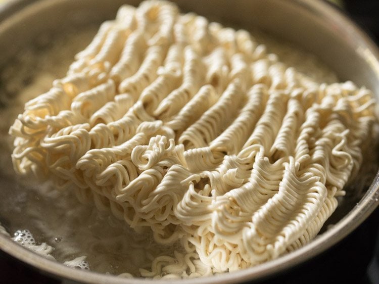 noodles added to boiling water. 