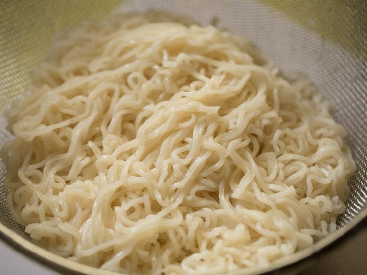 rinsing cooked noodles. 