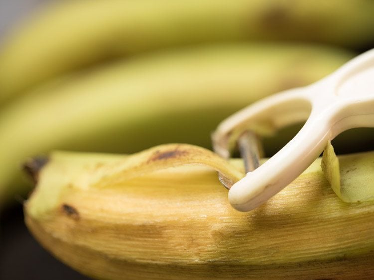 peeling raw bananas.