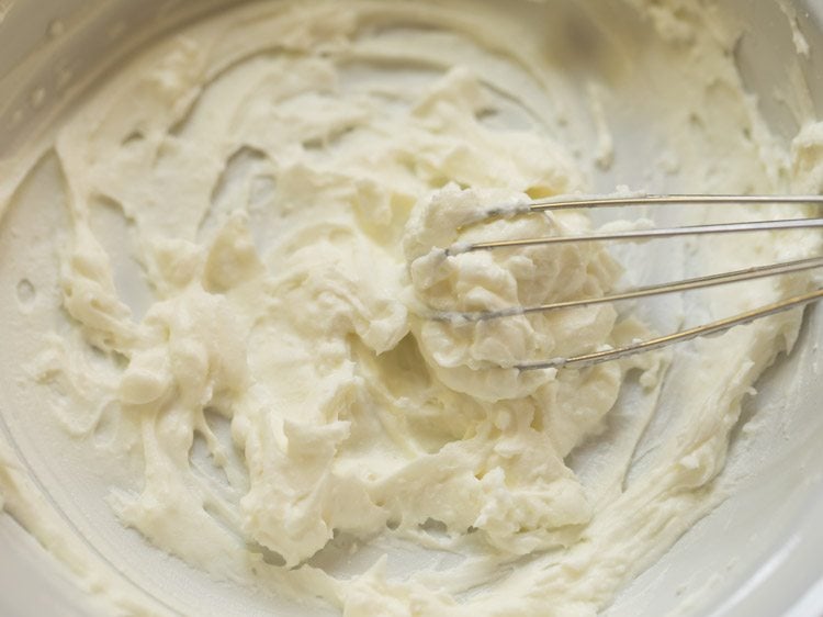 whisking hung curd till smooth. 