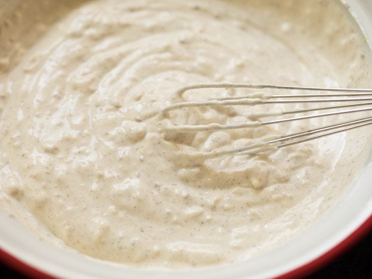 mixing ingredients with the hung curd-cream mixture. 