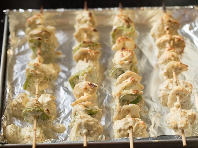 grilling paneer malai tikka. 