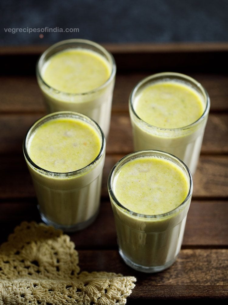 masala milk served in 4 glasses with text layover. 