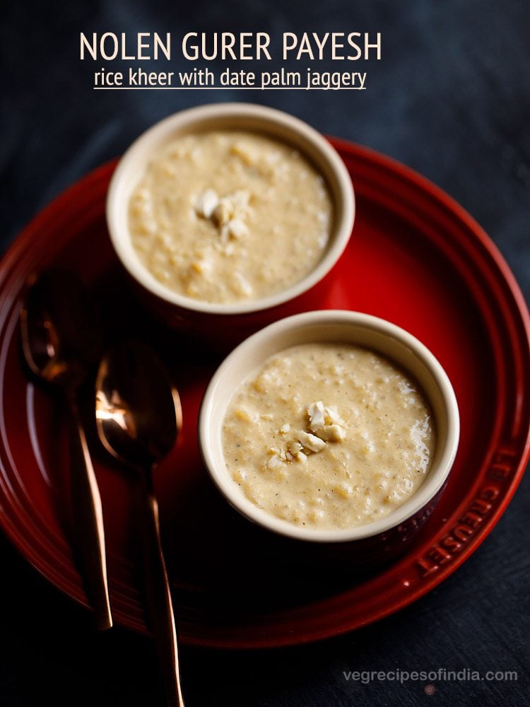 nolen gurer payesh garnished with chopped cashews served in 2 bowls with 2 spoons kept on the left side and text layovers.