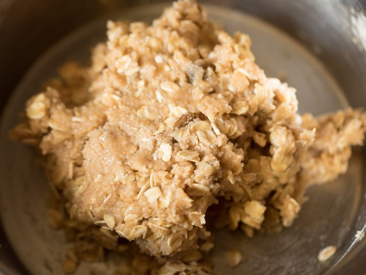 oatmeal cookie dough has gathered into a sticky ball, meaning no more milk is needed.