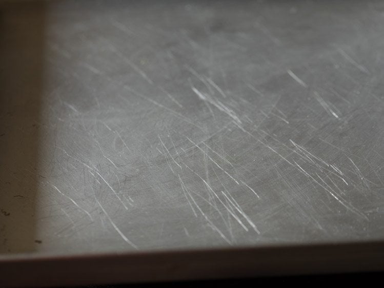 baking tray greased with some butter.