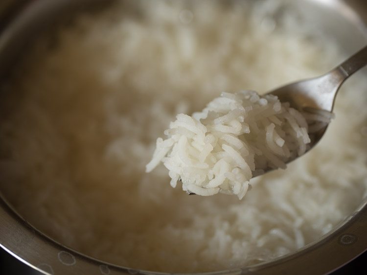 A scoop of cooked rice.