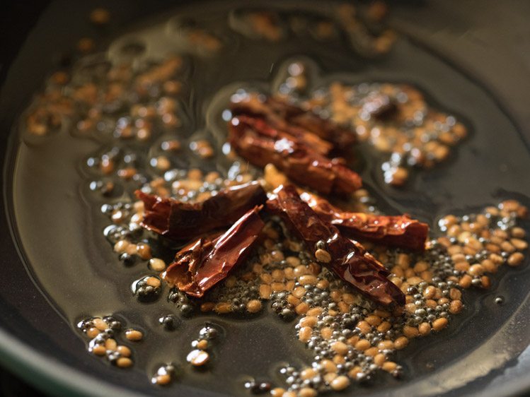 stirring the ingredients in the hot oil. 