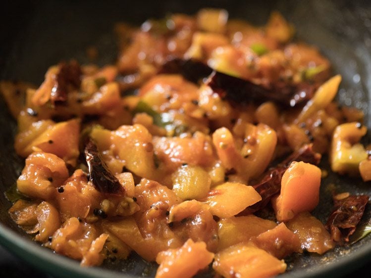 sautéing tomato mixture for thakkali pachadi.