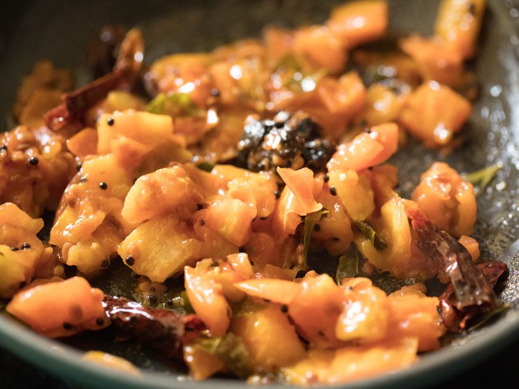 tamarind mixed well with the cooked tomato mixture. 