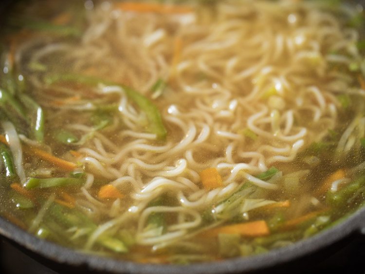 mixing noodle soup