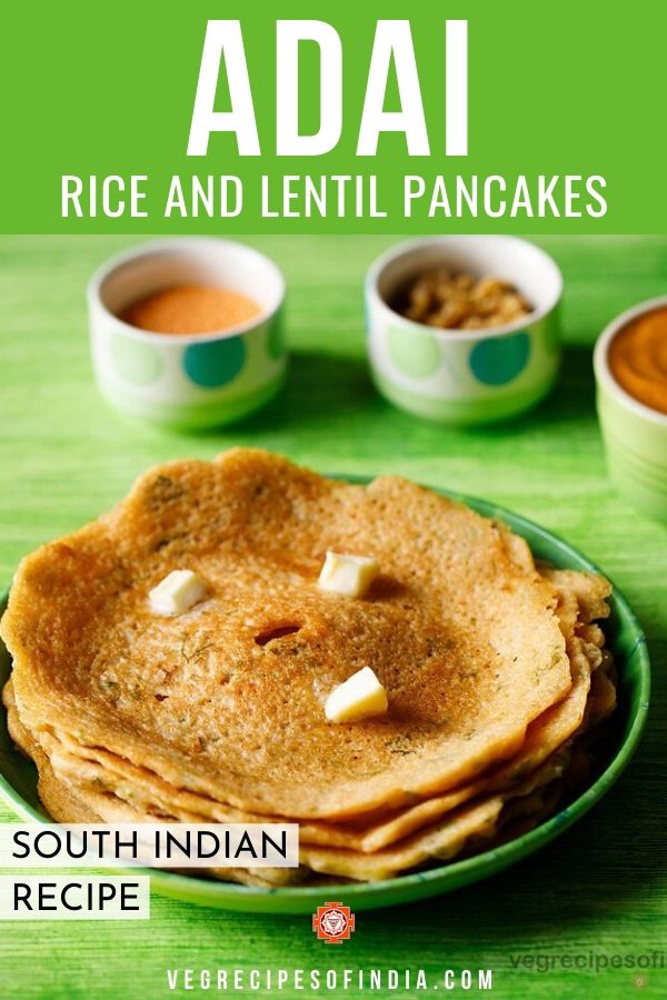 adai stacked and served on a green plate with butter cubes on top and bowls of chutney and sambar kept in the background and text layovers.