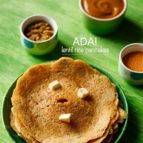 adai stacked and served on a green plate with butter cubes on top and bowls of chutney and sambar kept in the background and text layovers.