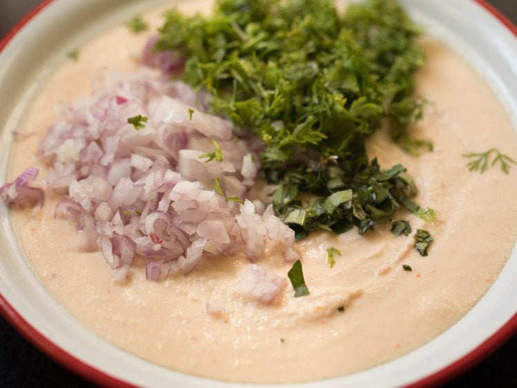 chopped onions, chopped coriander leaves and chopped curry leaves added to batter. 