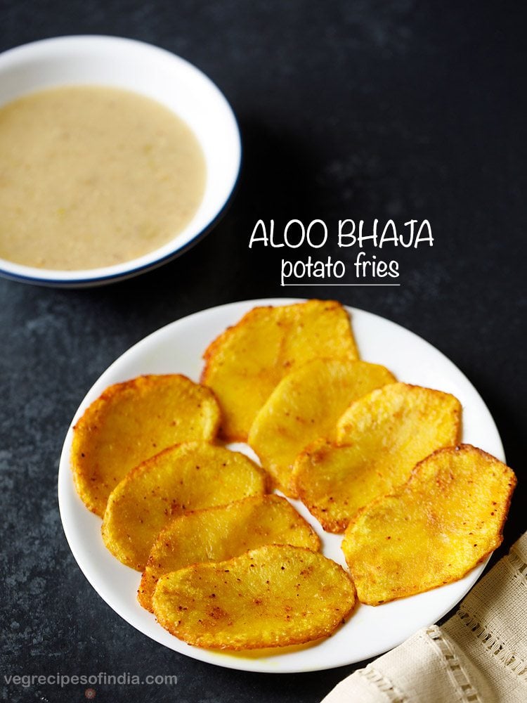 aloo bhaja served on a white plate with text layovers.