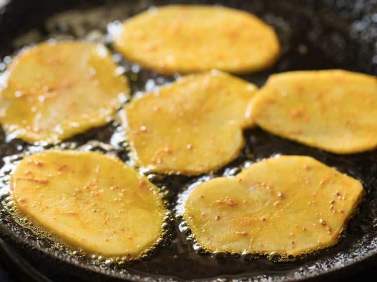 frying potato slices in hot oil. 