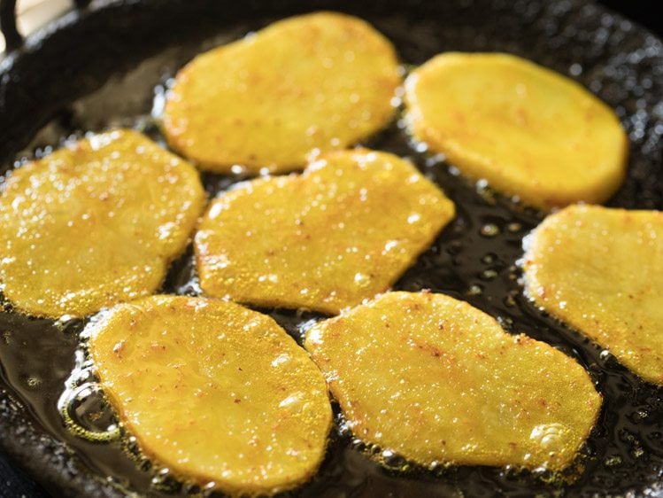 frying potato slices after turning over. 