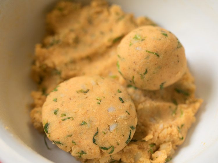 two aloo tikkis shaped from the prepared mixture. 