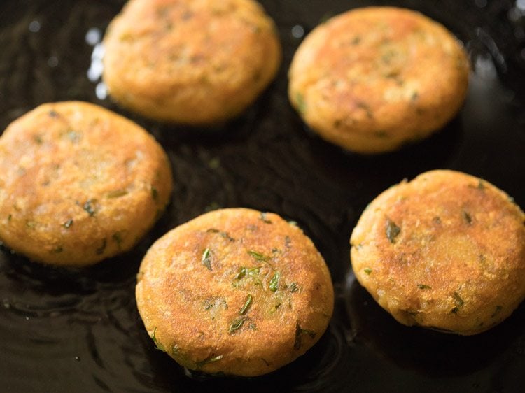 aloo tikkis flipped after one side being golden. 