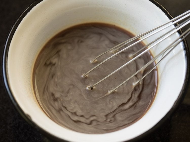 mix coffee powder with warm water