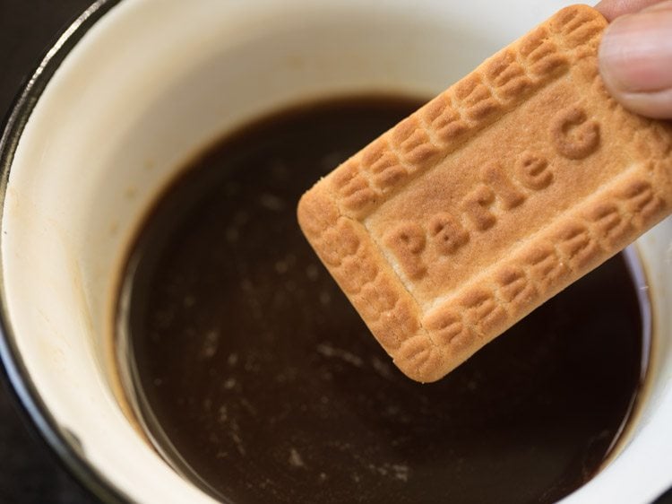 dip biscuit into coffee solution