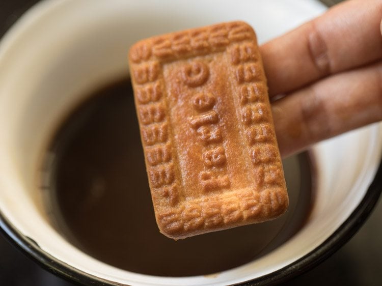 dip biscuit into coffee solution