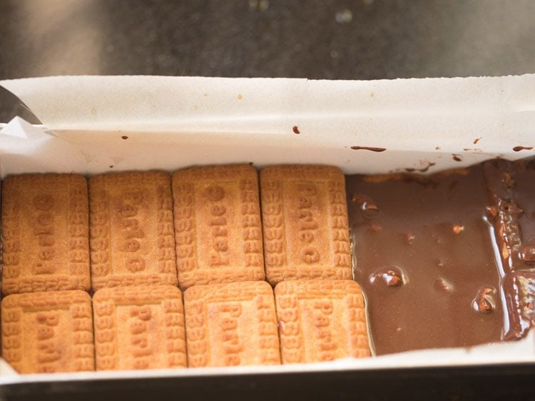 Make another third layer of coffee solution dipped biscuits.