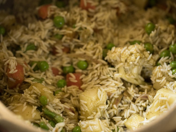 rice mixed with the vegetables. 