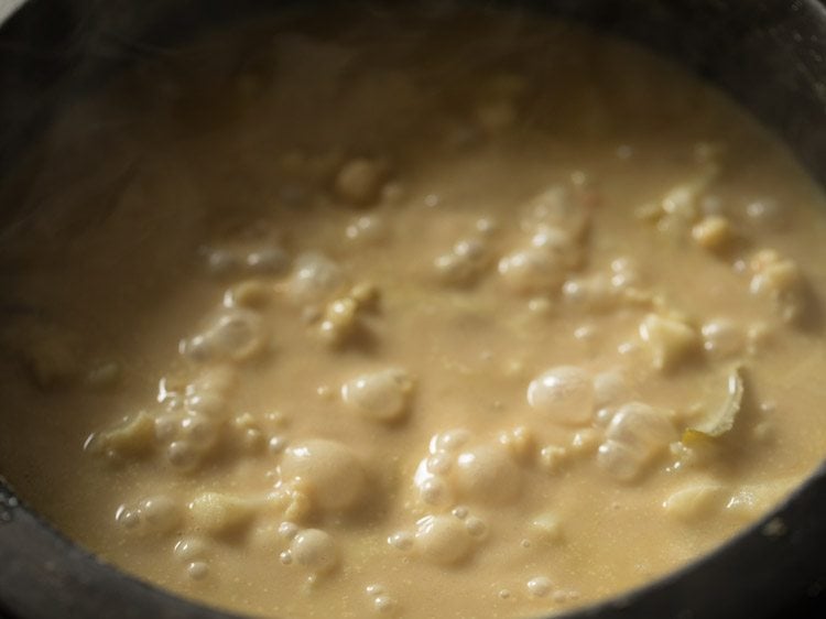 closeup of cauliflower korma cooking in saucepan