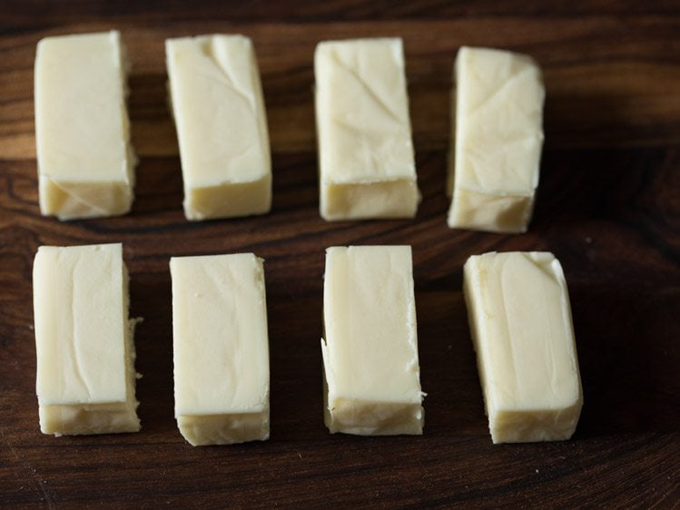 cheese cubes cut into 2 equal parts. 